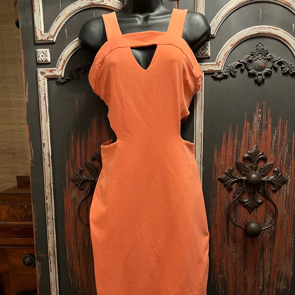 Bebe peach cut out dress. Spandex and elastane